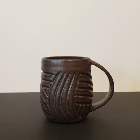 A Carved Bronzed Ceramic Mug